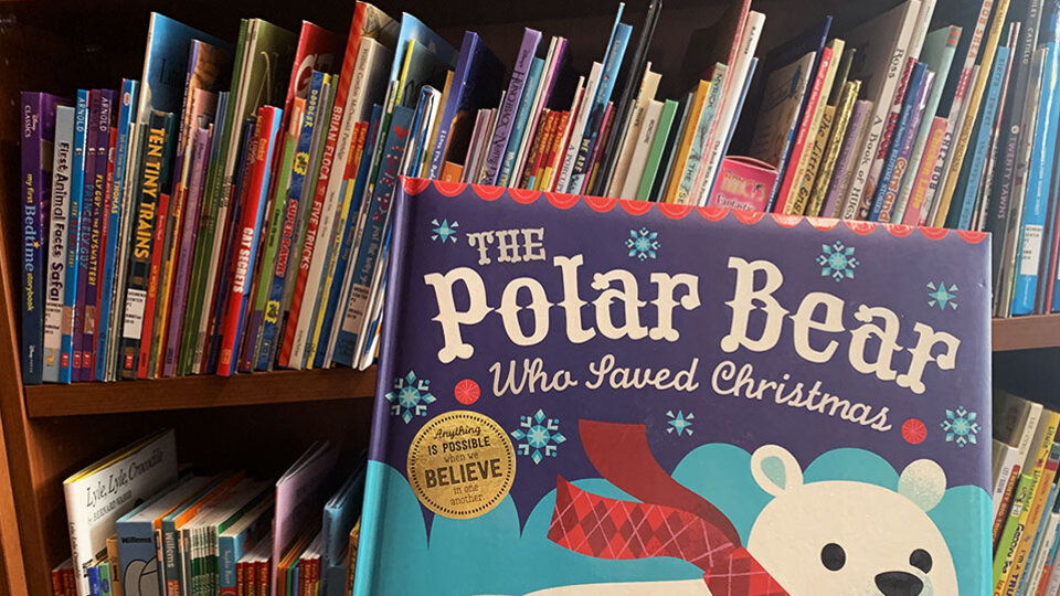 The book "The Polar Bear Who Loved Christmas" on display in the Children's Library.